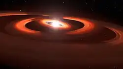 This illustration is based on NASA/ESA Hubble Space Telescope images of a gas and dust discs encircling the young star TW Hydrae.