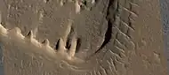 Close view of layered mesa with pyramid shapes, as seen by HiRISE under HiWish program.  This is part of an image that was named HiRISE Picture of the day.