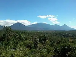 The five rowed volcanos in the coat of arms were inspired by the Cordillera de Apaneca volcanic range when El Salvador's Sonsonate City was the second capital of the Federal Republic of Central America in 1834.]