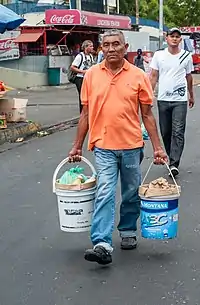 Similar plastic pails with different styles of plastic bail handles