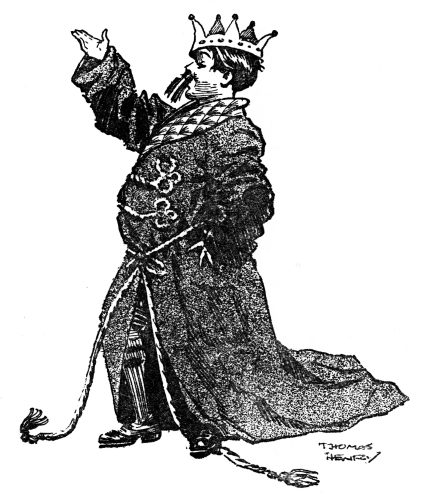 William wearing his father&rsquo;s dressing-gown and a tinsel crown.