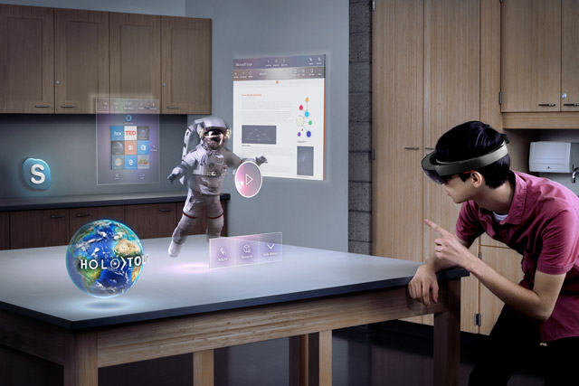 A man uses a Hololens device at home. A man uses a Hololens device at home.
