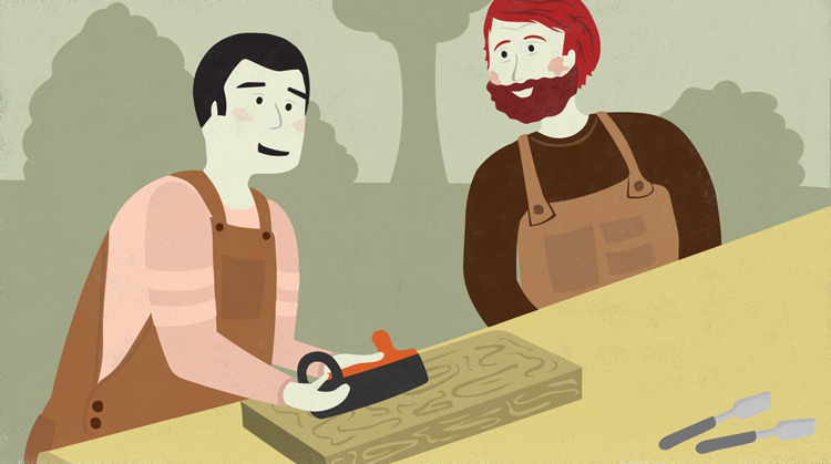 man showing a coworker how to use a hand plane man showing a coworker how to use a hand plane