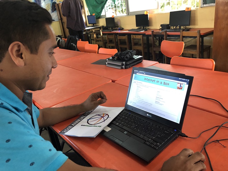 Man working with Internet-in-a-Box home page